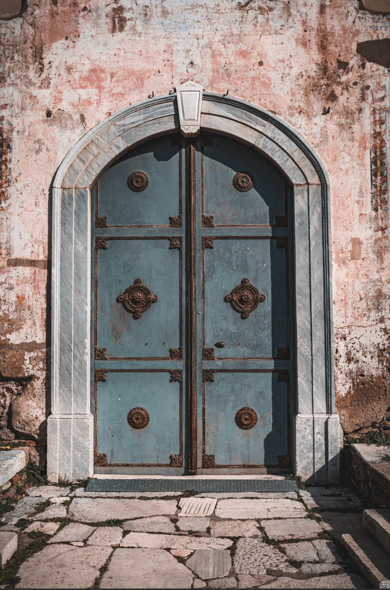 Vintage blue door with ornate details
